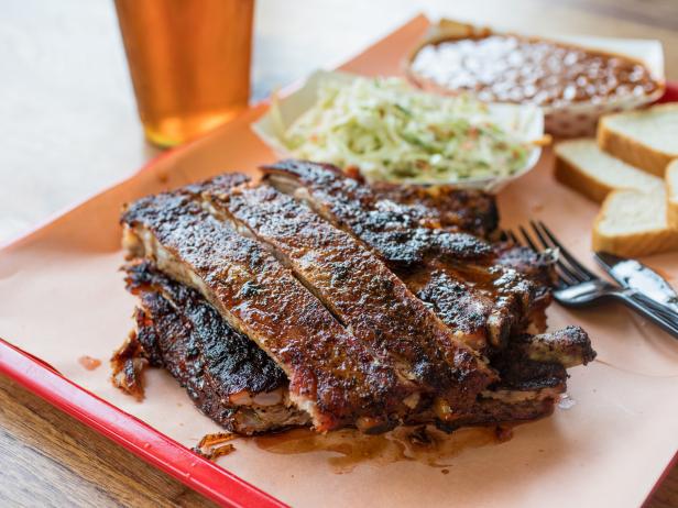 Rodney Scott’s Whole Hog BBQ signature dishes Whole Hog Pork Plate, Ribeye Sandwich, Spare Ribs, Banana Puddin'